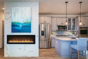 Modern bright kitchen with a wall mounted fireplace