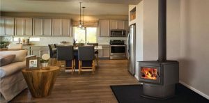 Tidy kitchen with a wood burning fireplace