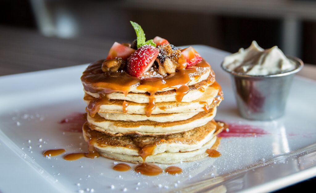 Stack of breakfast in bed pancakes for Valentine's Day.