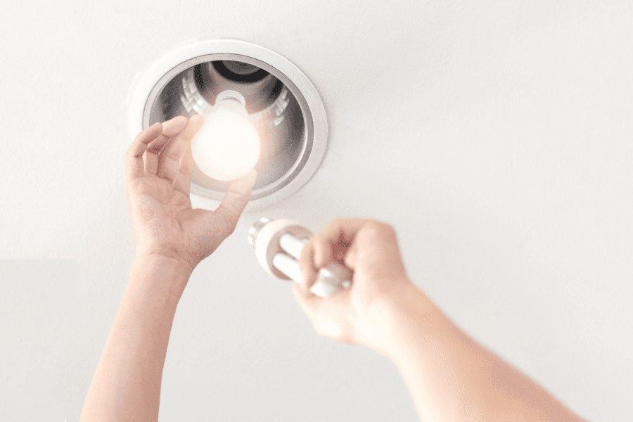 Switching old light bulb with eco-friendly LED light bulbs.