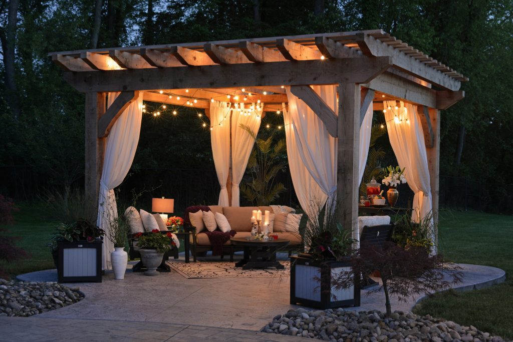 Cozy backyard with a pergola and patio furniture.