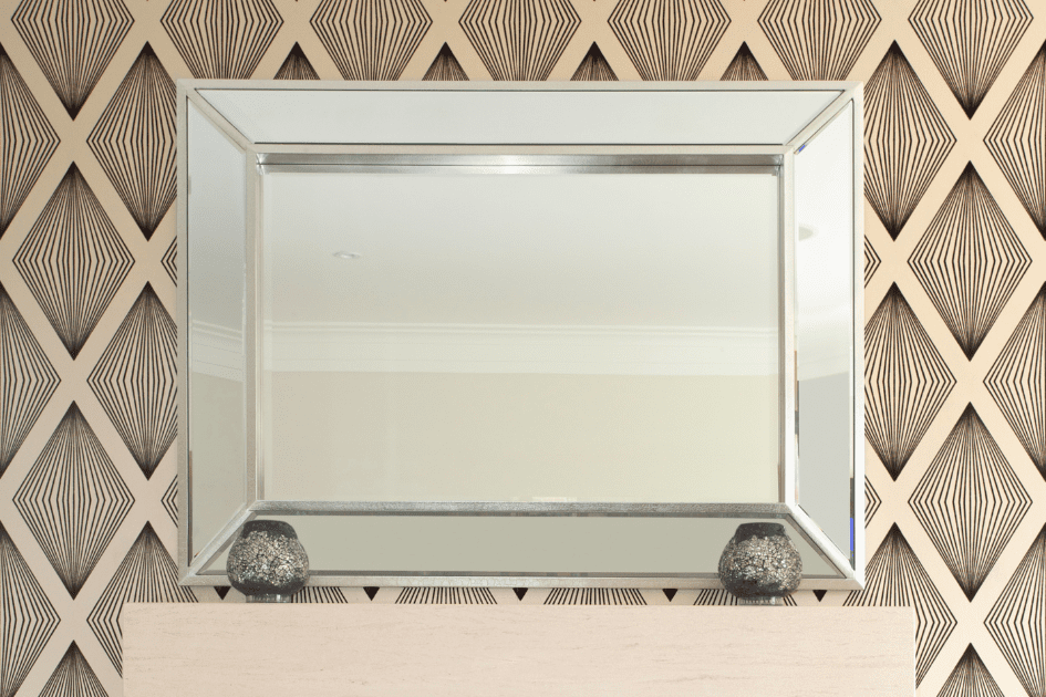 Metallic accents on a fireplace mantle 