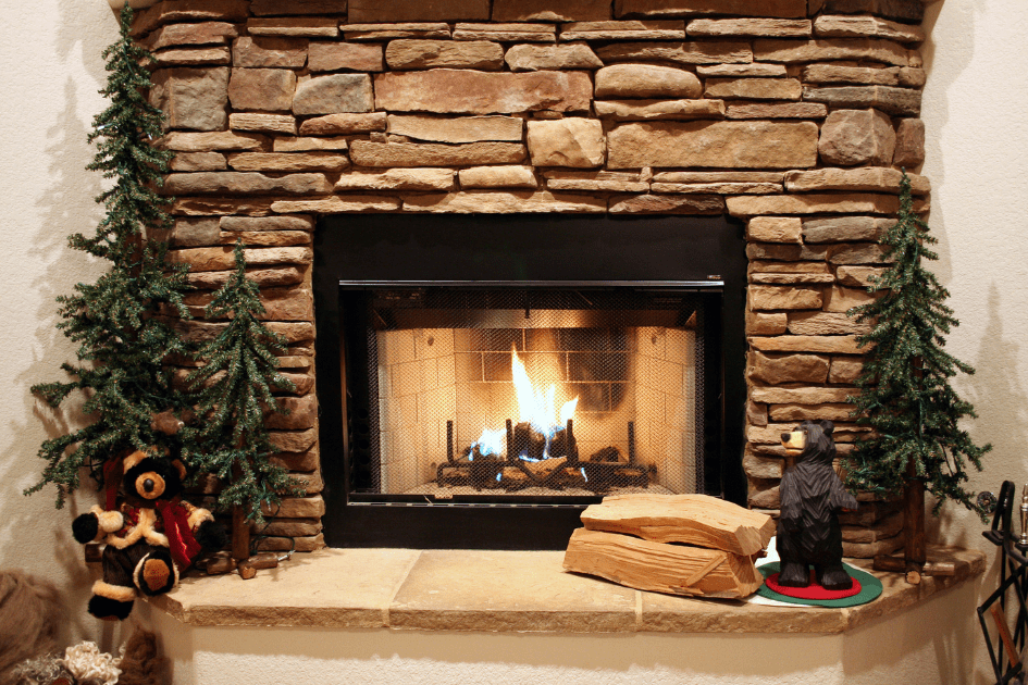 Pine trees and bears around a lit fireplace 