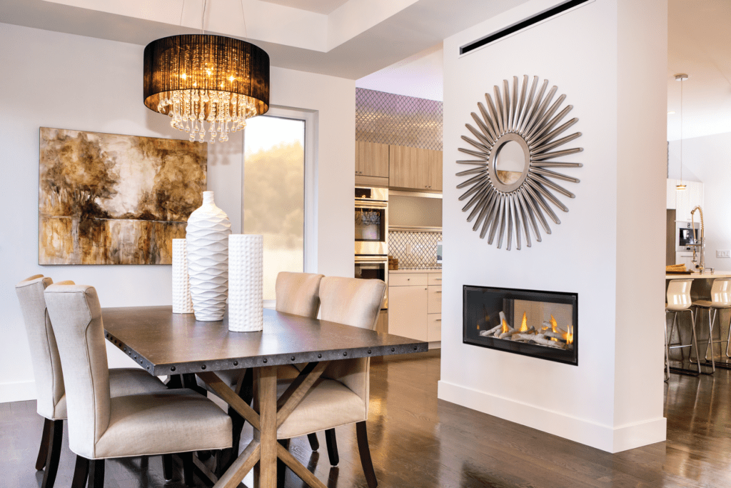 Open dining room to kitchen with see through fireplace separating them