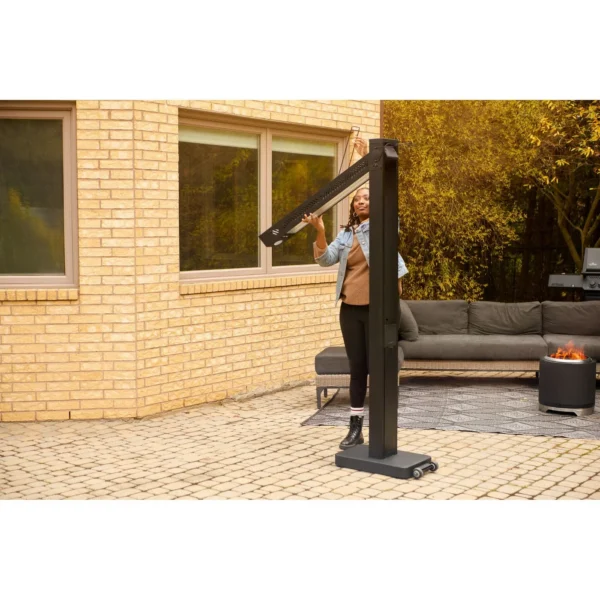 Napoleon Phantom Freestand Electric Outdoor Heater person using